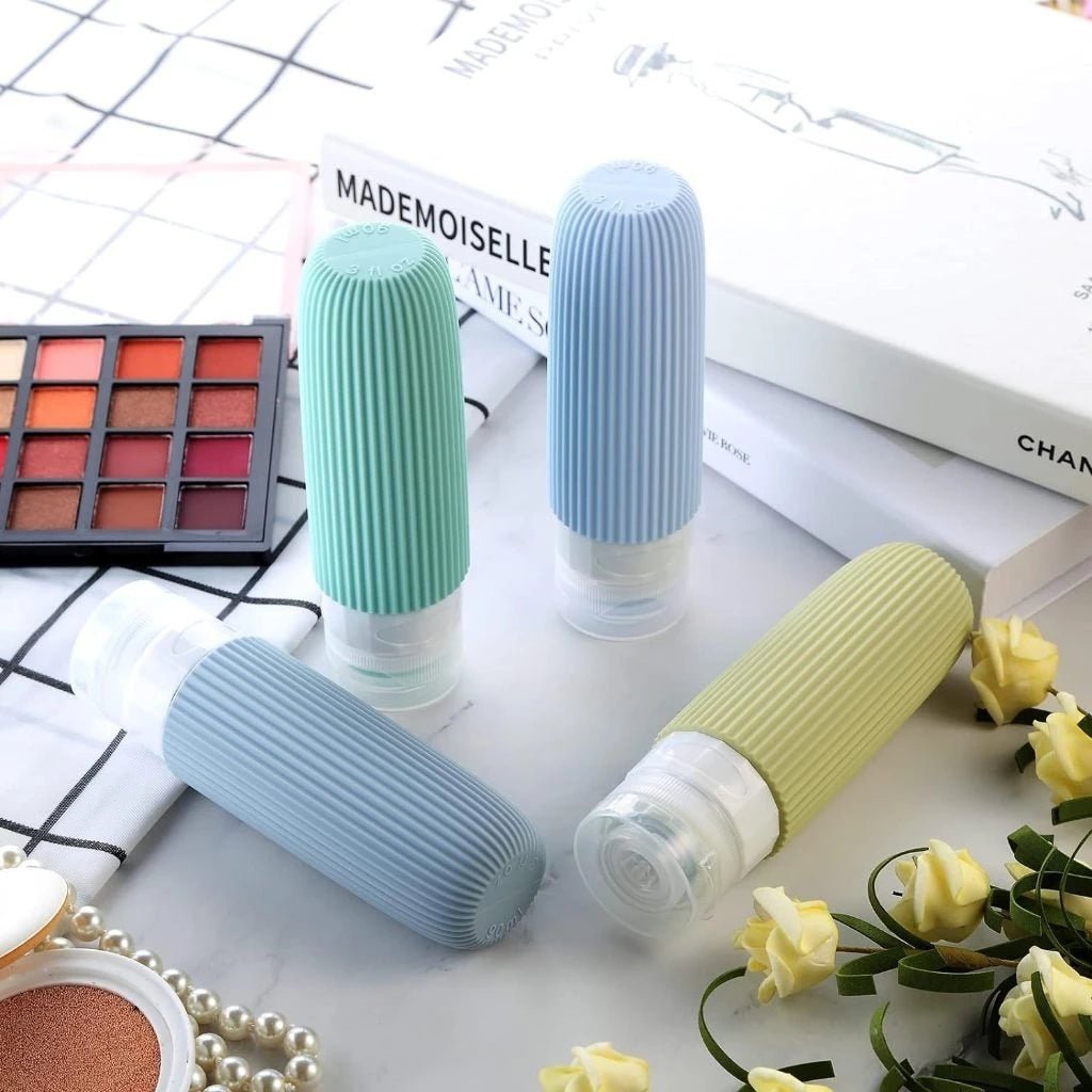 Frascos de silicone coloridos, práticos e reutilizáveis — perfeitos para viagens.