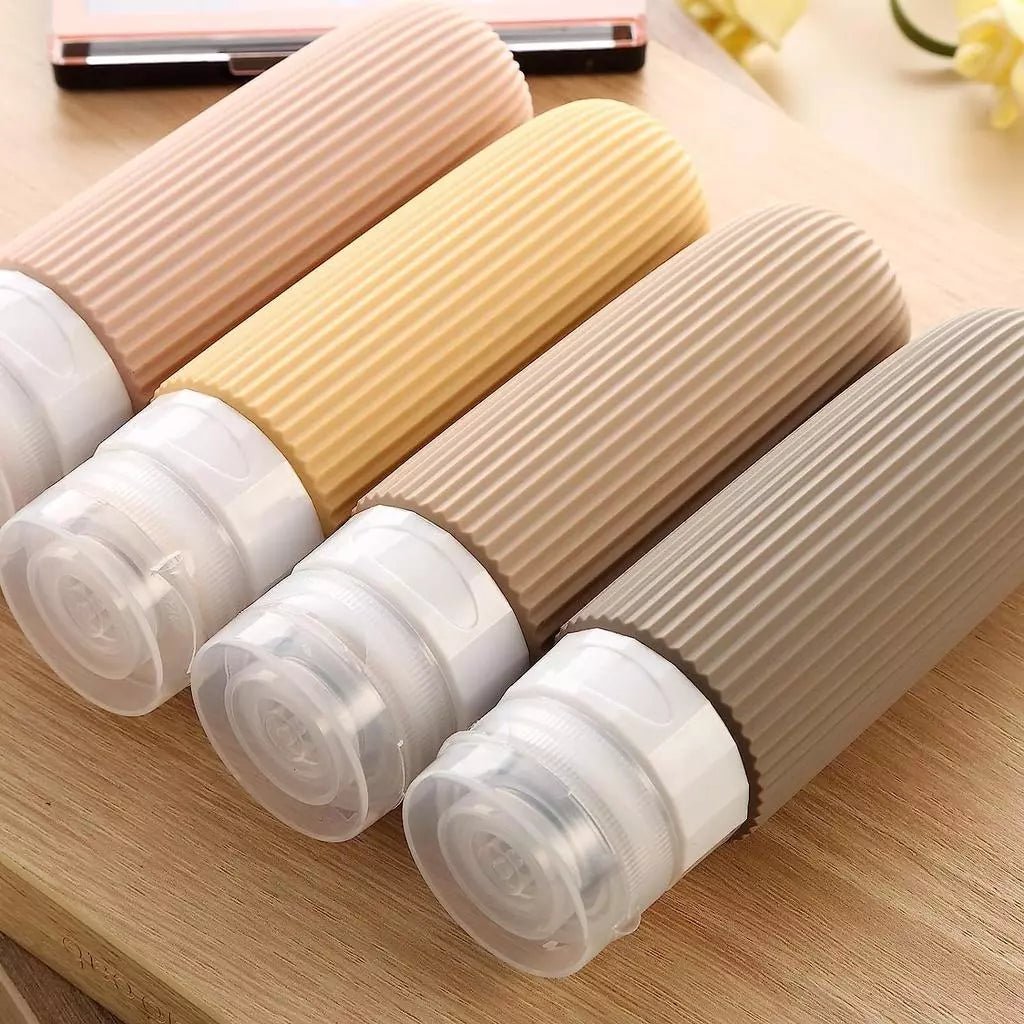 Frascos de silicone coloridos, práticos e reutilizáveis — perfeitos para viagens.